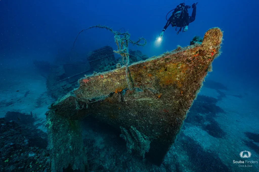 Diver at the bow of a sunken ship on the try dive and wreck dive experience in Malta